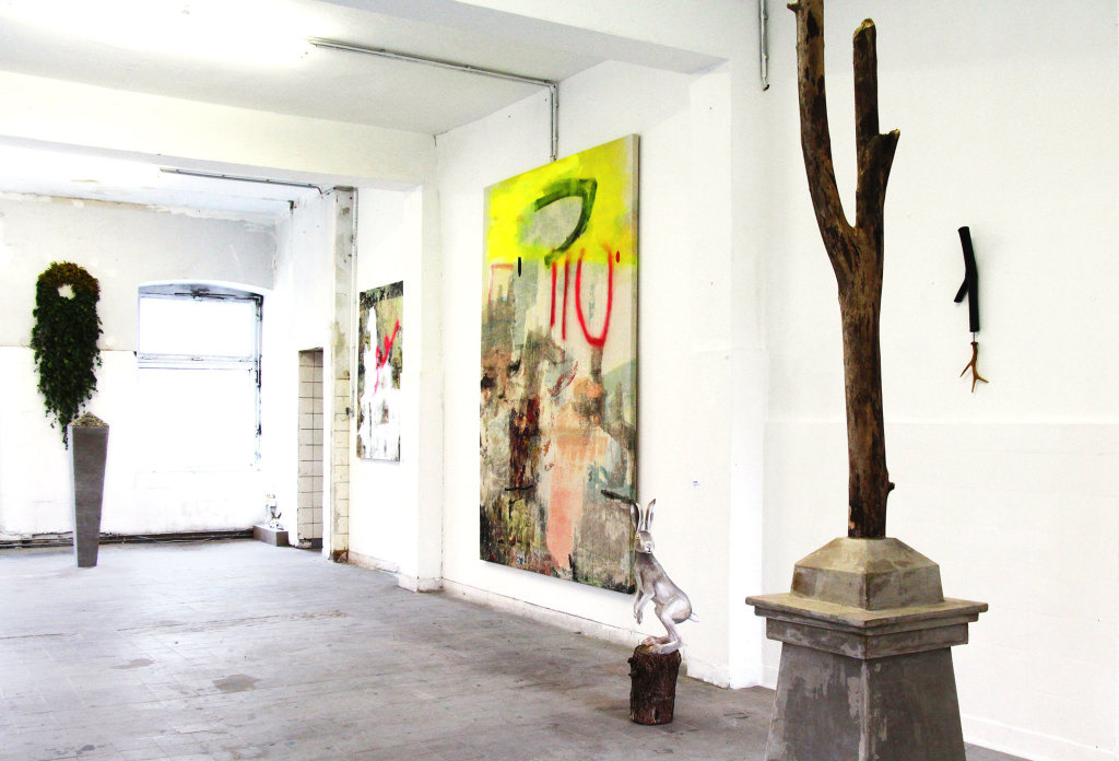 Installation view of Spinnerei Rundgang for Pilotenkueche residency. Paintings: Jenny Brosinski Sculpture: Jenn Garland (wood, concrete rubble, polystrene, acrylic coating, mdf, Silver birch leaves, Tillandsia, Canada Goldenrod) 